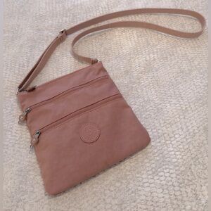 Kipling pink shoulder or crossbody bag - 2 outside pockets, 1 inside pocket